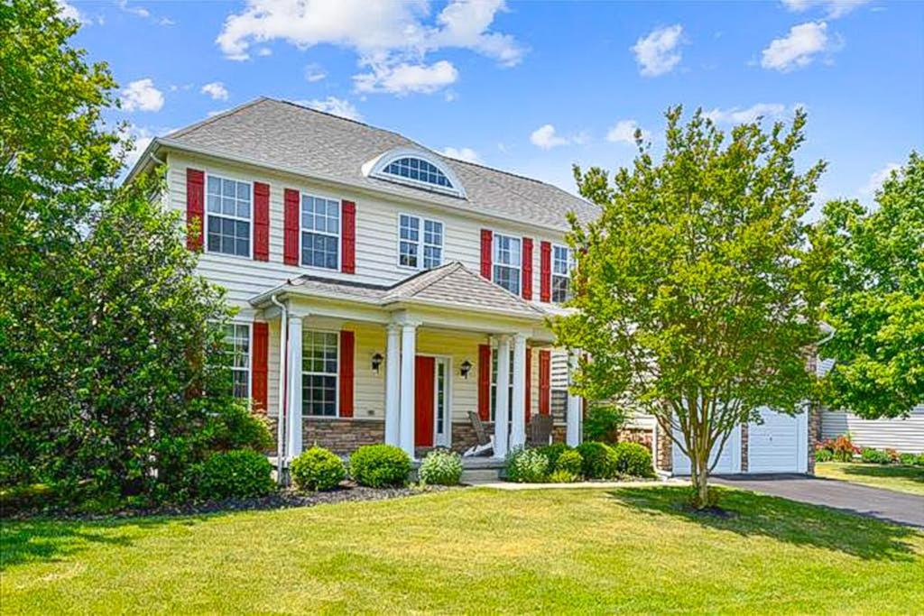 a large white house with red shutters at Wedgefield -- 1 Wedgefield in Ocean View