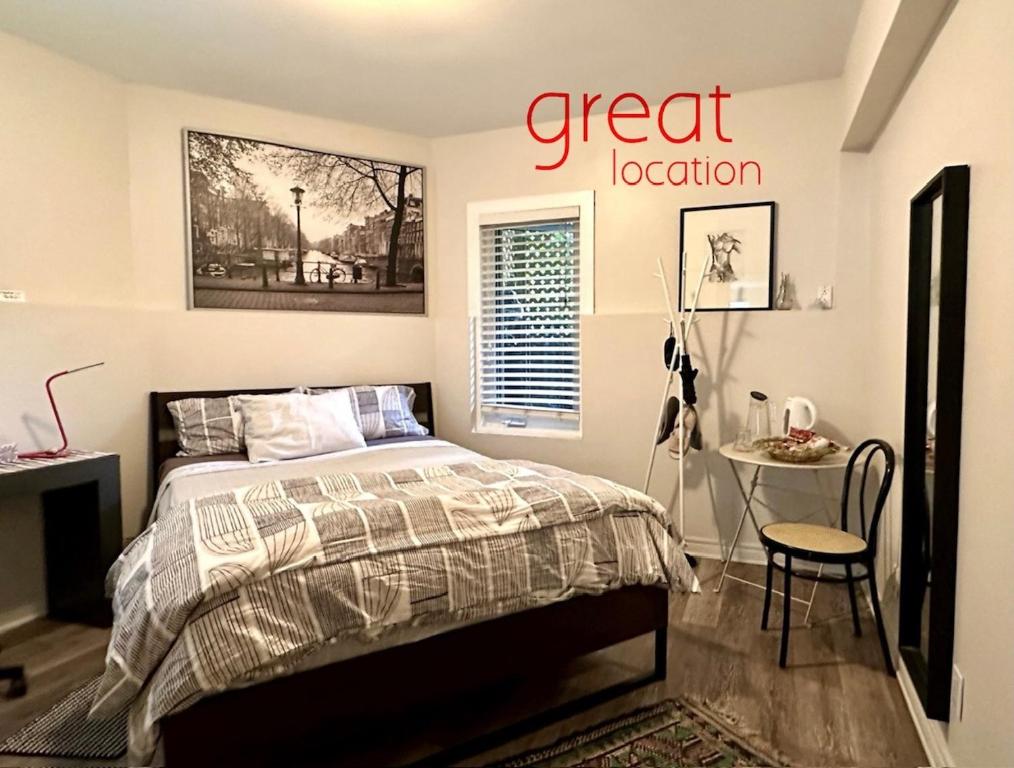 a bedroom with a bed and a sign that reads great location at A Gem Downton Montreal in Montreal
