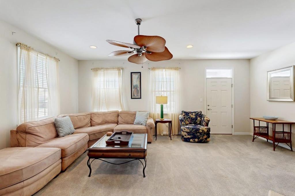 a living room with a couch and a ceiling fan at Bayside Resort - 36398 Azalea Ave in Selbyville