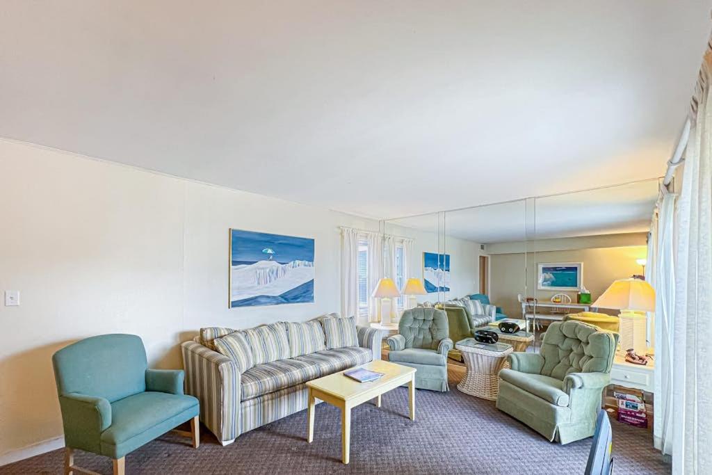 a living room with couches and chairs at Sunspot Condo --- 2 McKinley Ave, Unit 103 in Dewey Beach