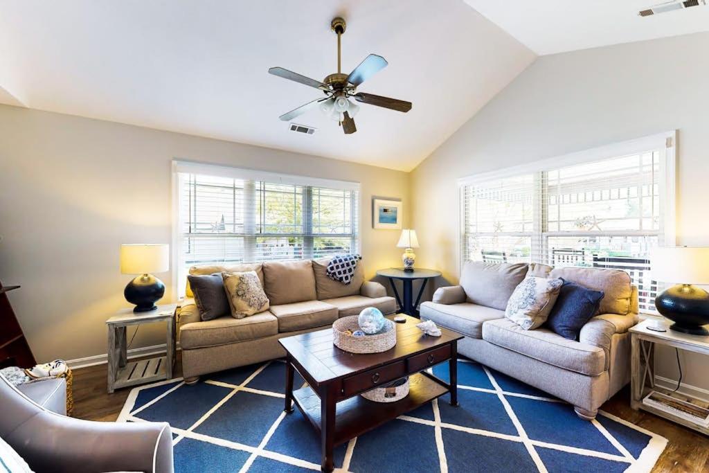 a living room with a couch and a table at Forest Reach --- 33720 Chatham Way in Frankford
