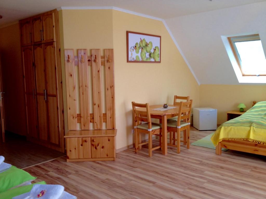 Postel nebo postele na pokoji v ubytování VIDOR Vendégház