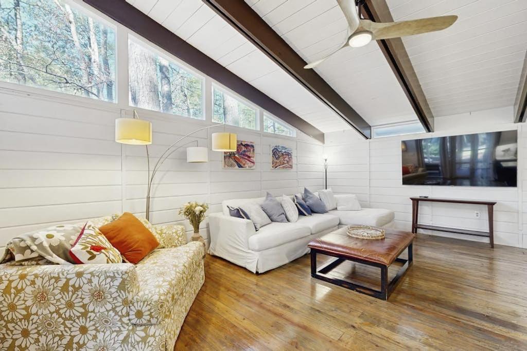 a living room with two couches and a table at Middlesex Beach - 9 Bridge in Bethany Beach