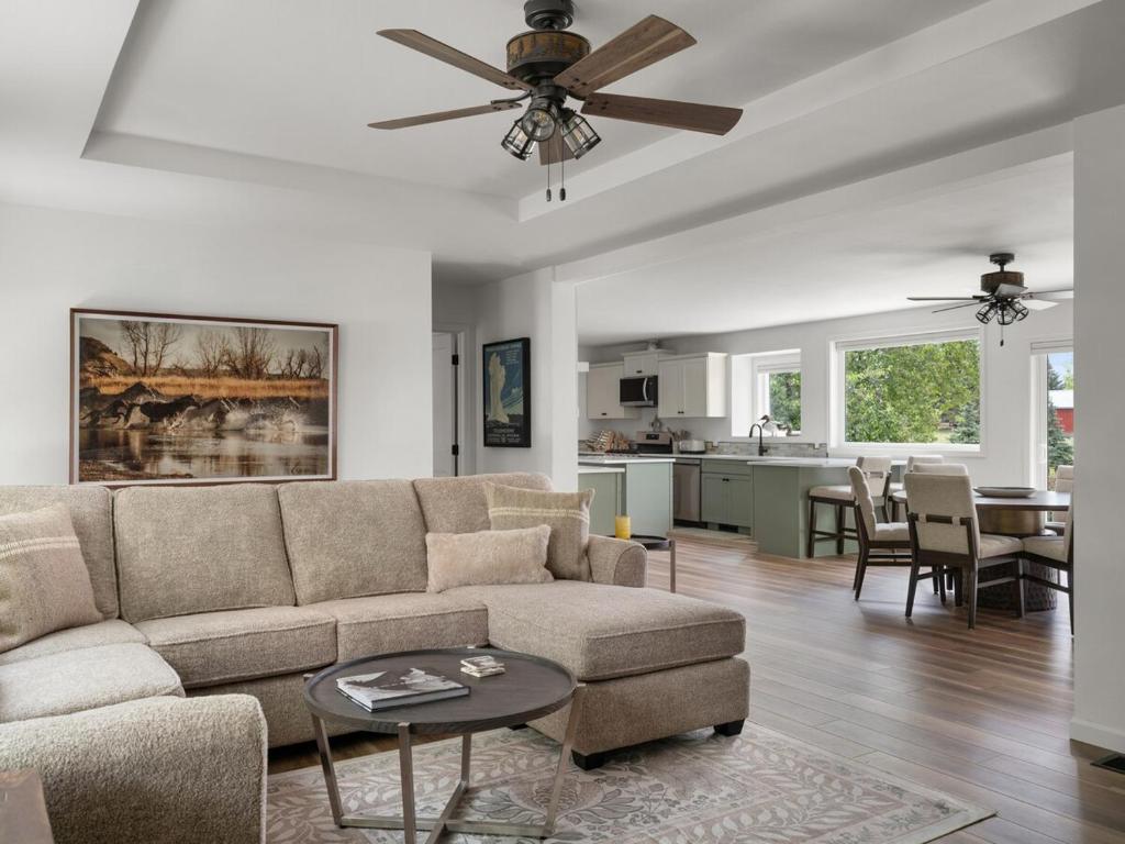 a living room with a couch and a table at Mountain View Home on 2 Acres in Bozeman