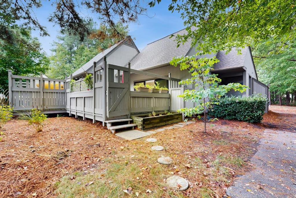 a large house with a porch and a yard at Sea Colony - 7903 Timberlake in Bethany Beach