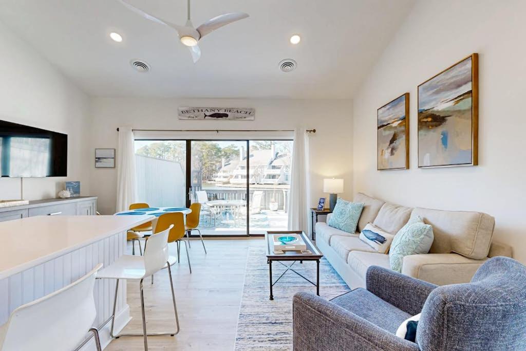 a living room with a couch and a table at Sea Colony West Pine in Bethany Beach