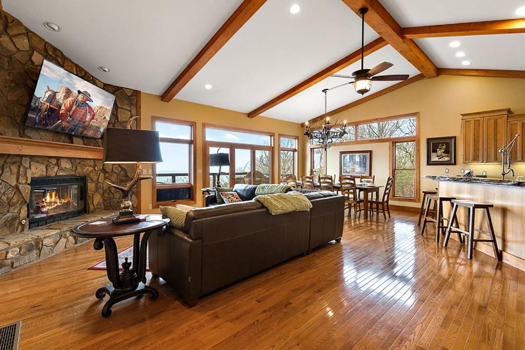 a living room with a couch and a fireplace at Bella Vista in Beech Mountain