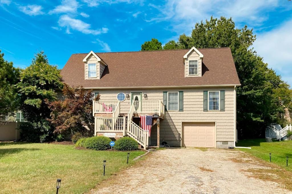a house with a large yard with a driveway at The Reservation --- 38601 Indian Trail in Ocean View