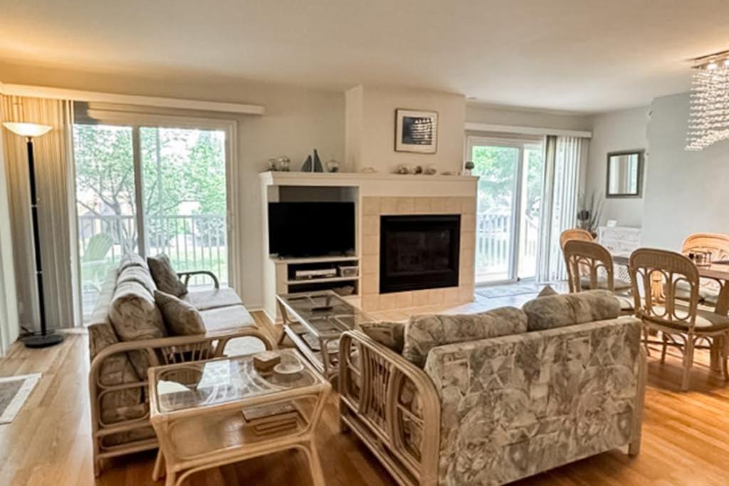 a living room with a couch and a fireplace at Sea Colony --- 55032 Pine Lake Dr in Bethany Beach