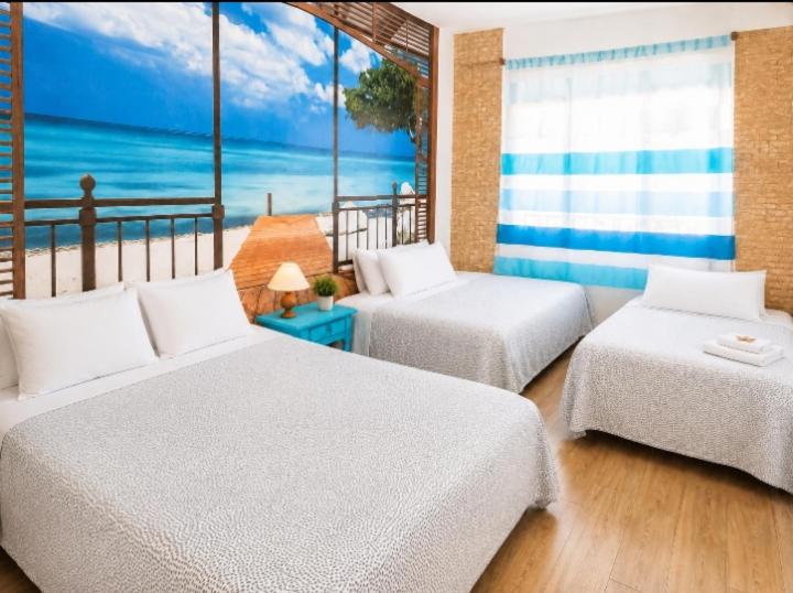 a bedroom with two beds and a view of the ocean at Camino de Santiago Can Pau Costa Brava in Llança