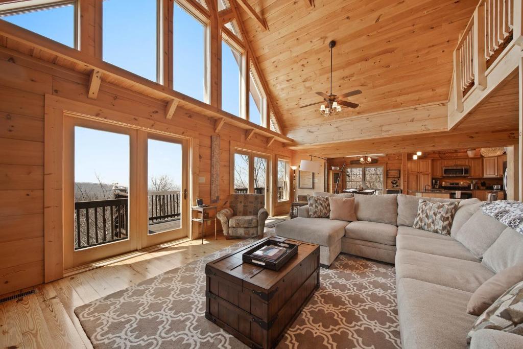 a living room with a couch and a table at Western Wonder in Beech Mountain