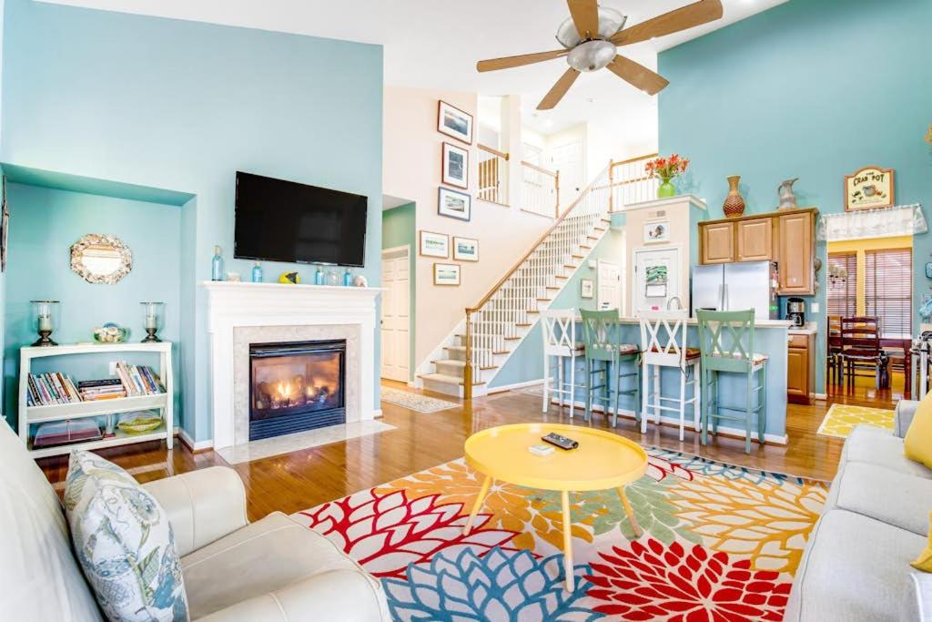 a living room with a couch and a fireplace at Bayview Landing - 38013 Bayview Circle in Selbyville