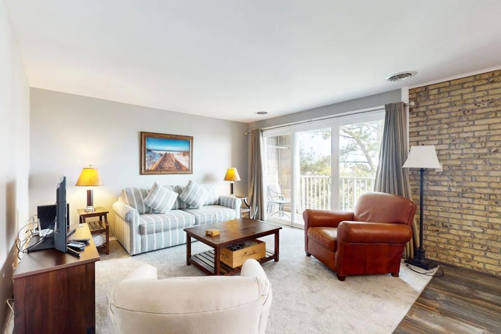 a living room with a couch and a chair at Rehoboth Beach -- The Crest #303 in Rehoboth Beach