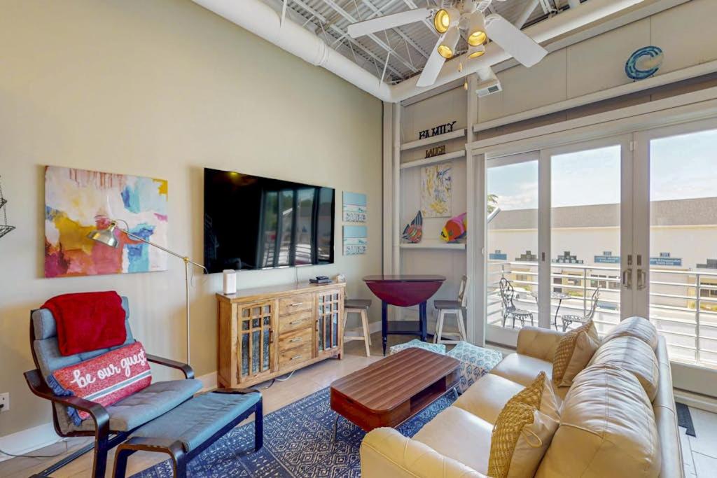 a living room with a couch and a tv at Rehoboth Beach --- Forj Lofts, Unit #2 in Rehoboth Beach