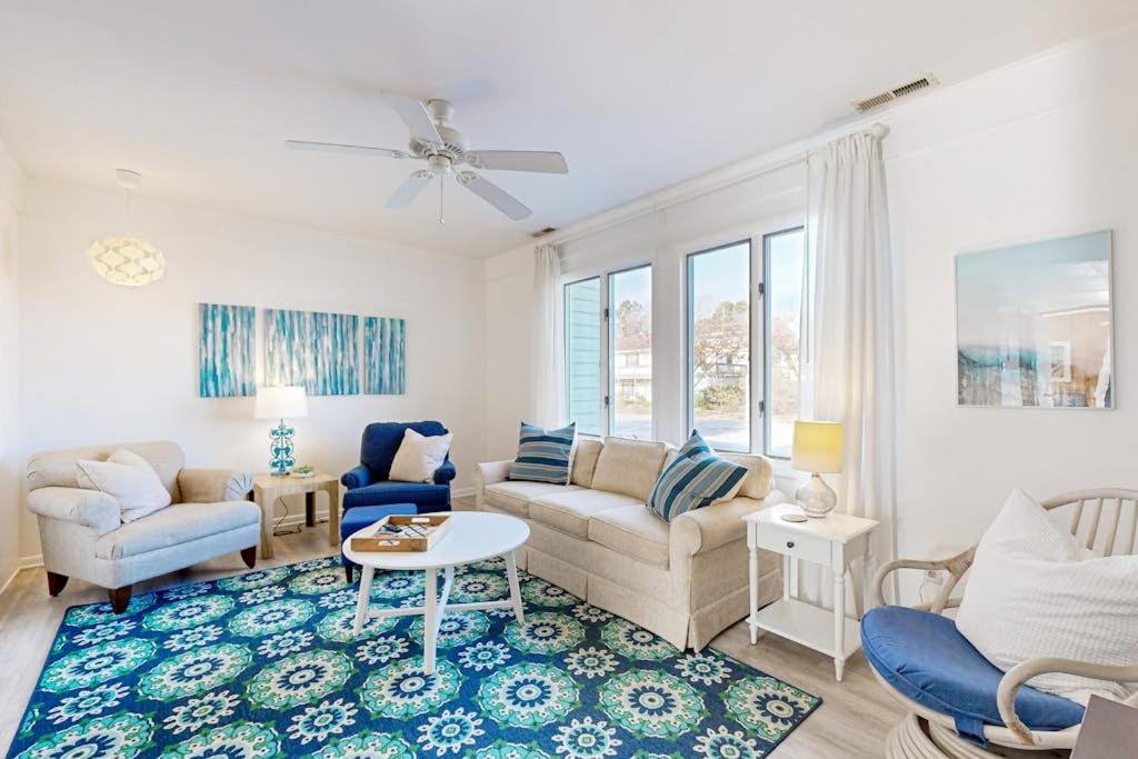 a living room with a couch and a table at Hidden Harbour -- 306 Ocean View Parkway in Bethany Beach