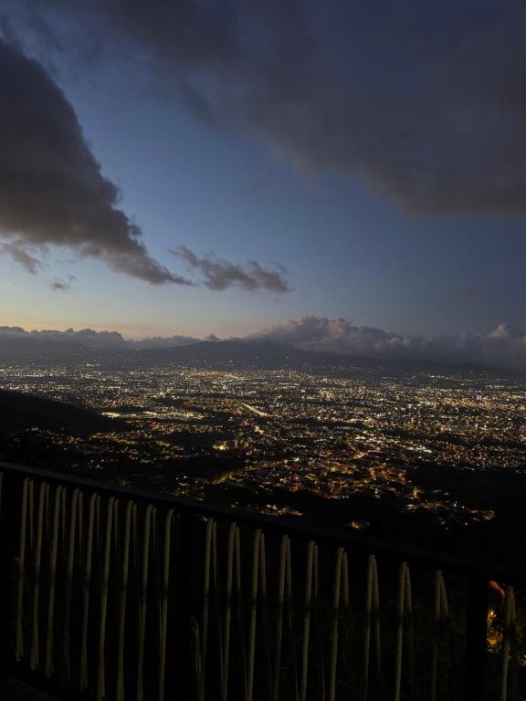 a view of a city from the top of a building at Villas Amíwa in Alajuelita