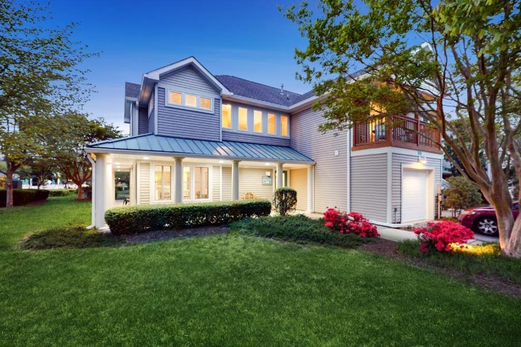 a large house with a lawn in front of it at Sea Colony - 56182 Pine Branch Way in Bethany Beach
