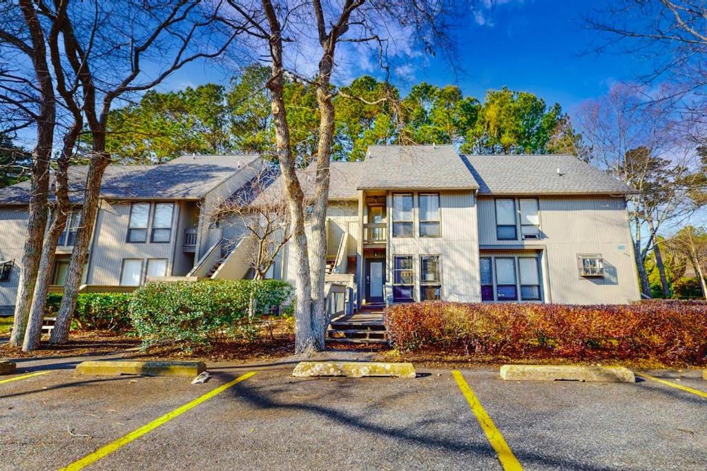 a large white house with a tree in a parking lot at Sea Colony - 2805 Center Ct in Bethany Beach