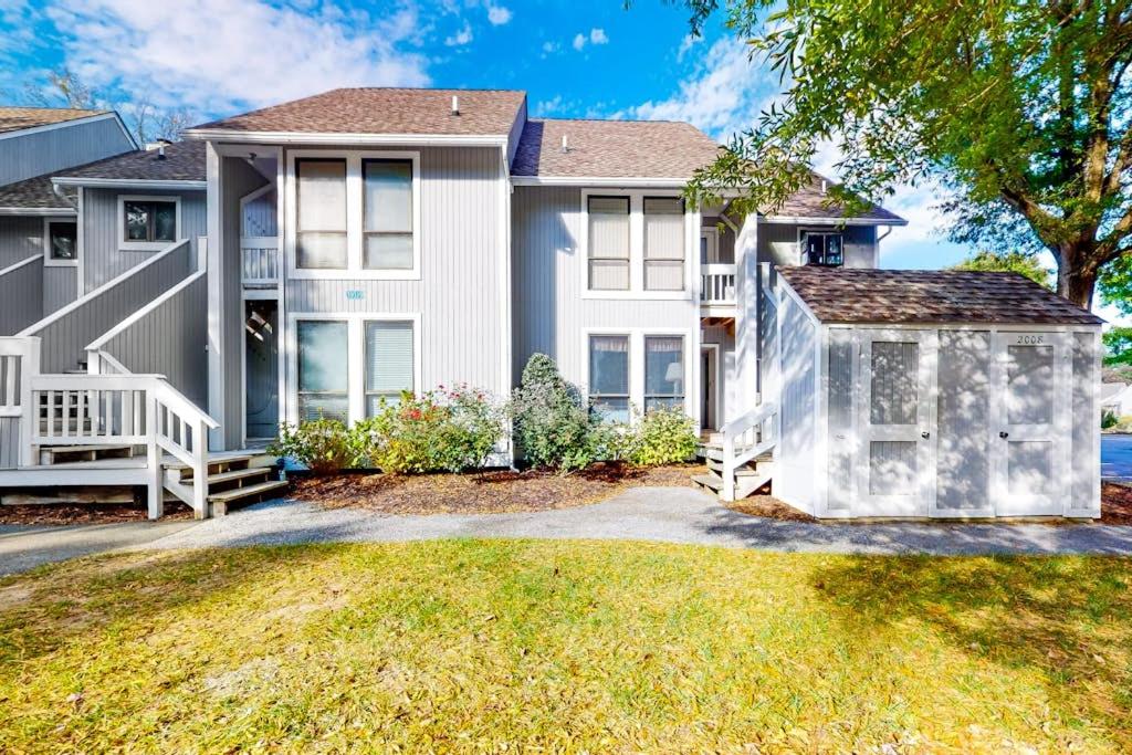 a large white house with a yard at Sea Colony - 2008E Brighton Ct in Bethany Beach