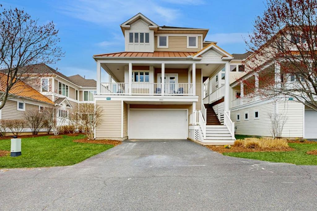 a large white house with a garage at Sea Colony - 58011 Wimbledon in Bethany Beach