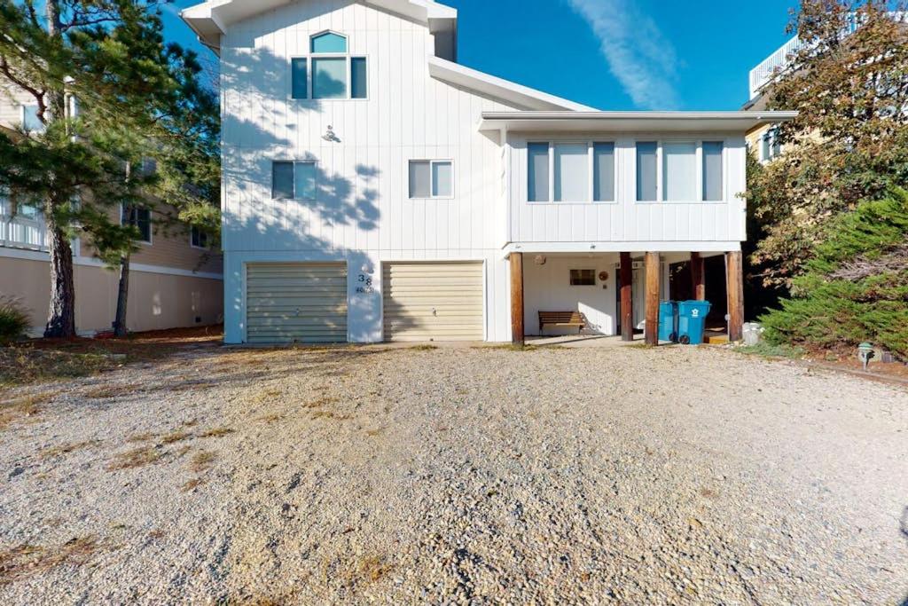 a white house with a driveway in front of it at Sea Del Estates - 38 Sugar Hill in Bethany Beach