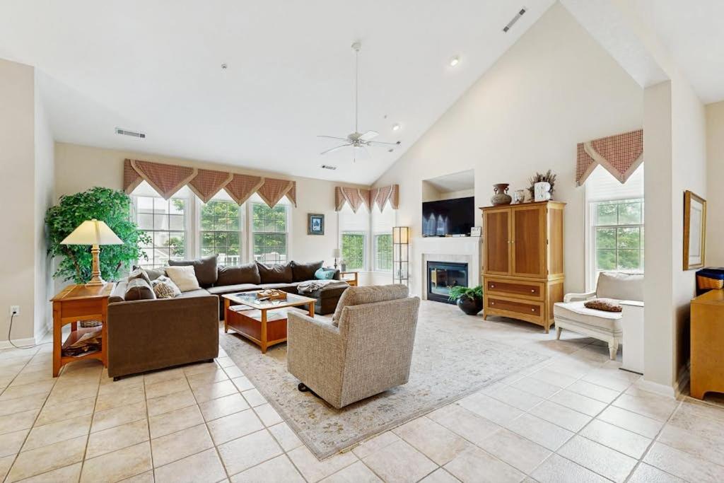 a large living room with couches and a fireplace at Bear Trap Dunes - 1D Clubhouse in Ocean View