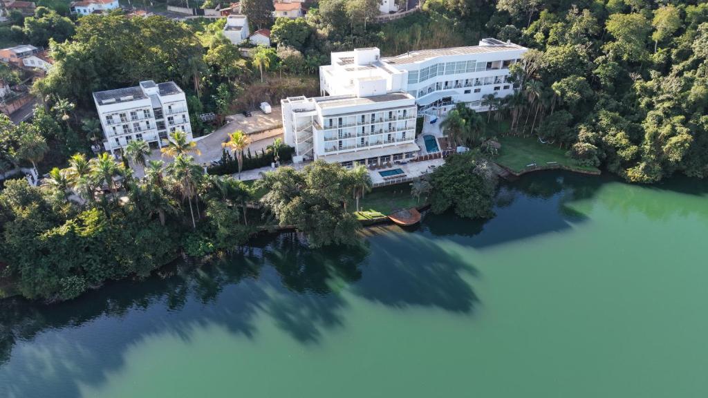 an aerial view of a building on the water at Hotel Beira Rio in Piraju