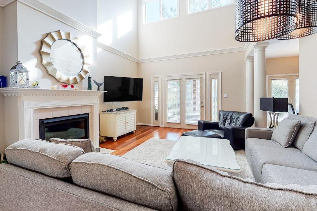 a living room with a couch and a fireplace at Sea Colony - 56032 Great Pine in Bethany Beach