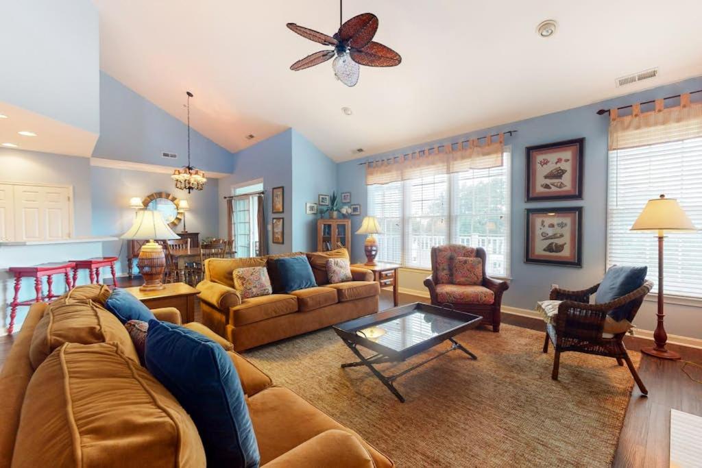 a living room with a couch and a table at Bear Trap Dunes - 58D October Glory in Ocean View