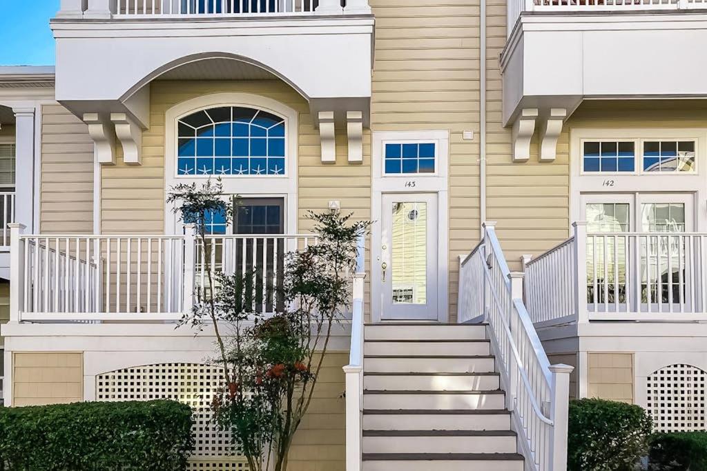 a house with stairs leading to the front door at Bayside at Bethany Lakes #143 in Ocean View