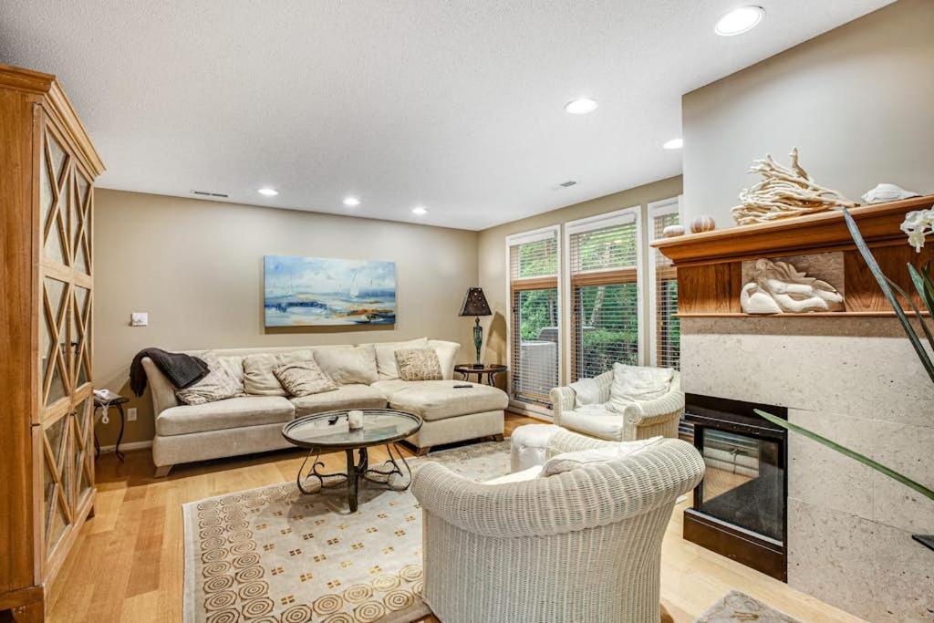 a living room with a couch and a fireplace at Sea Colony - 52028 Canal Ct in Bethany Beach