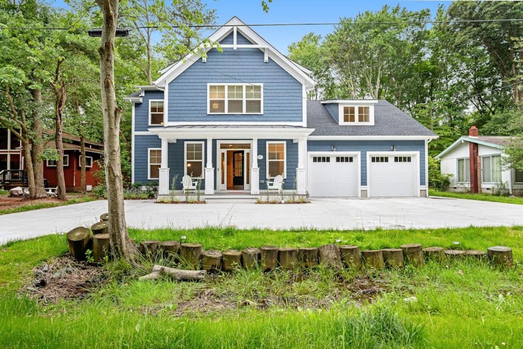 a blue house with a white garage at Bethany West --- 557 Fairway in Bethany Beach