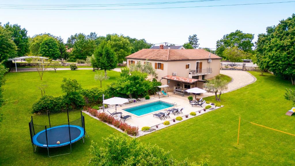 an aerial view of a house with a swimming pool at Family Villa Krizanci Istria in Žminj