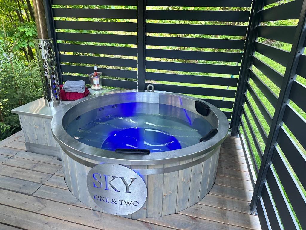 a large blue tub sitting on a deck at SKY one & two in Smržovka