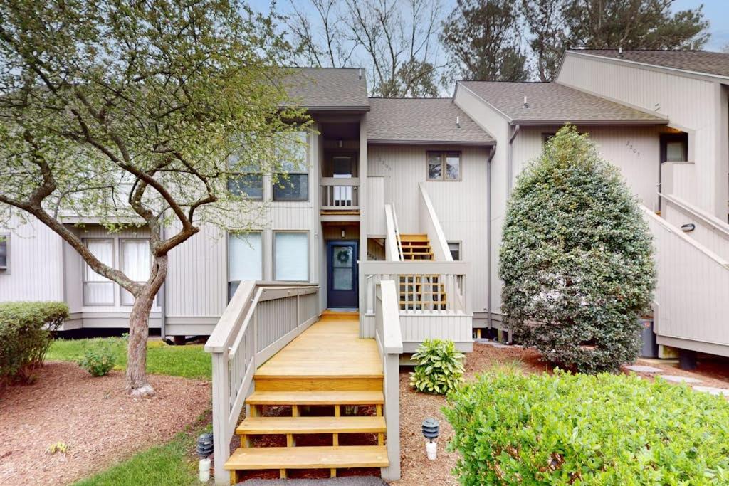 a house with a staircase in front of it at Sea Colony --- 2203 Round Robin in Bethany Beach