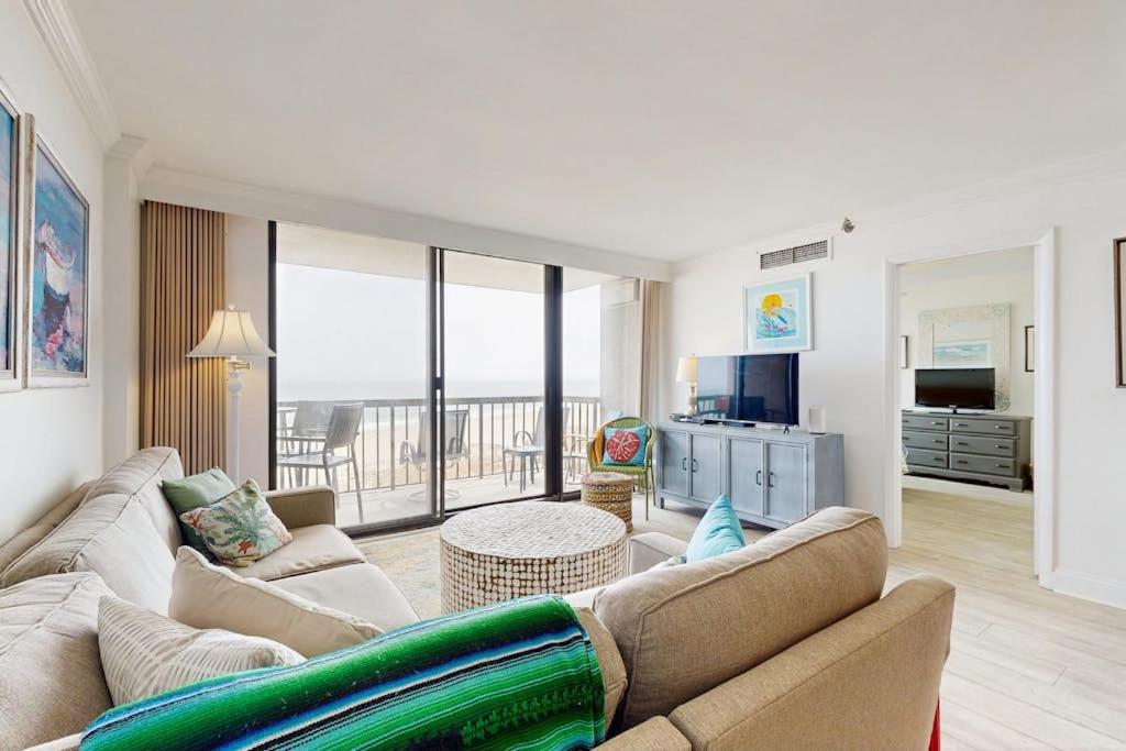 a living room with a couch and a room with a view at Sea Colony - 507 Georgetown House in Bethany Beach