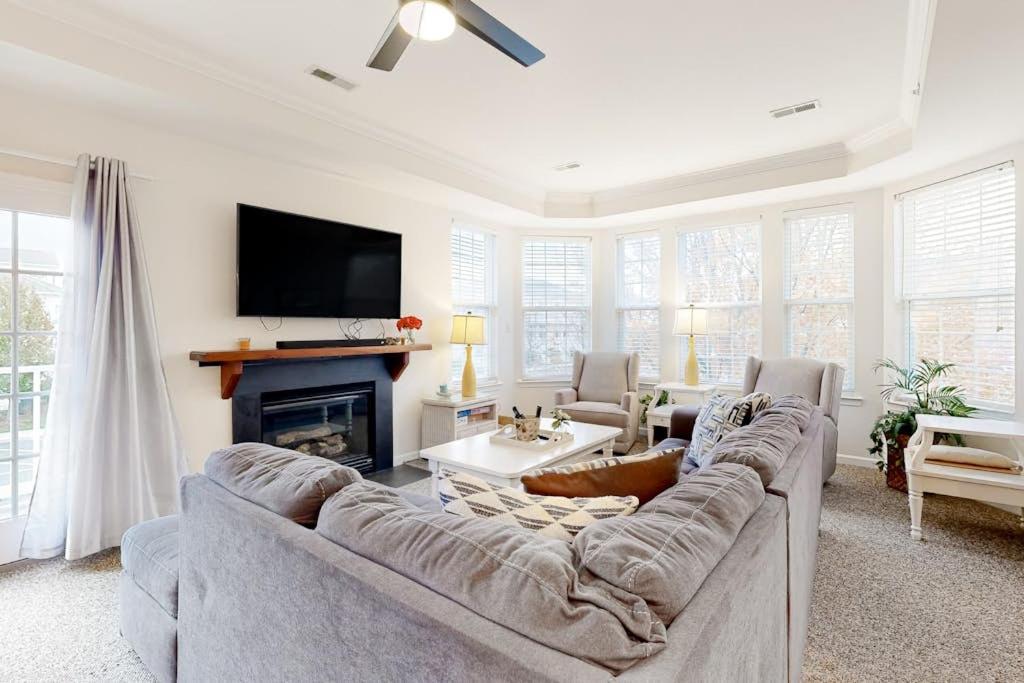 a living room with a couch and a tv at Bayside Bethany Lakes N Mill #114 in Ocean View