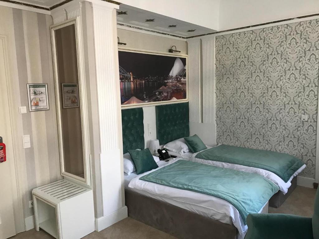 Postel nebo postele na pokoji v ubytování Hotel Amts-Apotheke