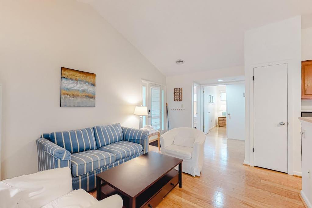 a living room with a couch and chairs and a table at Sea Colony -- 8901 Timberlake in Bethany Beach