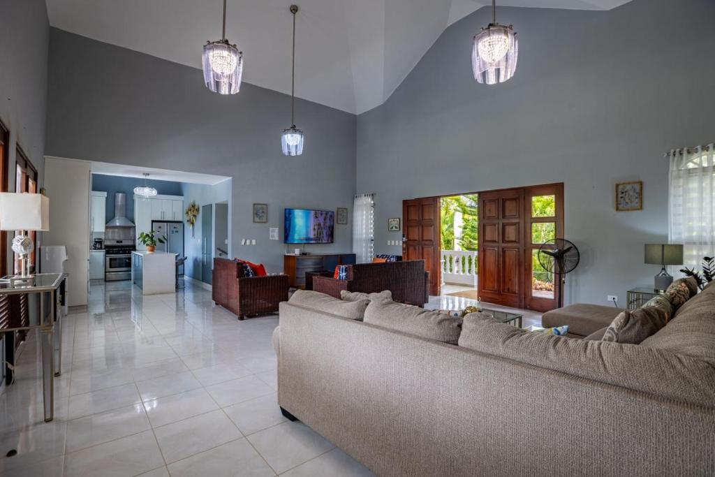 a large living room with two couches and a living room at Private Pool Villa - BBQ - Washer in Sosúa