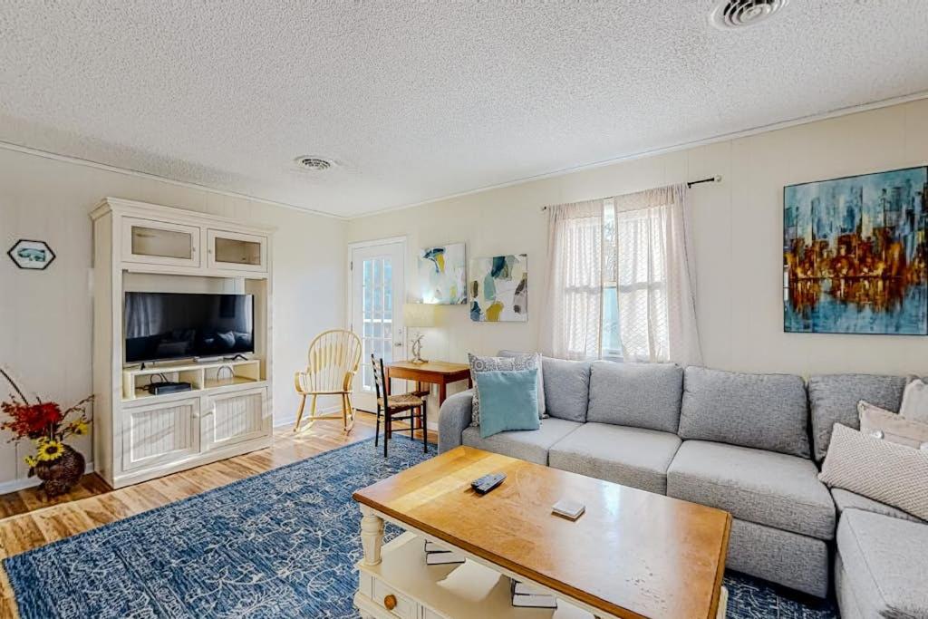 a living room with a couch and a table at Rehoboth Beach Anna B St in Rehoboth Beach