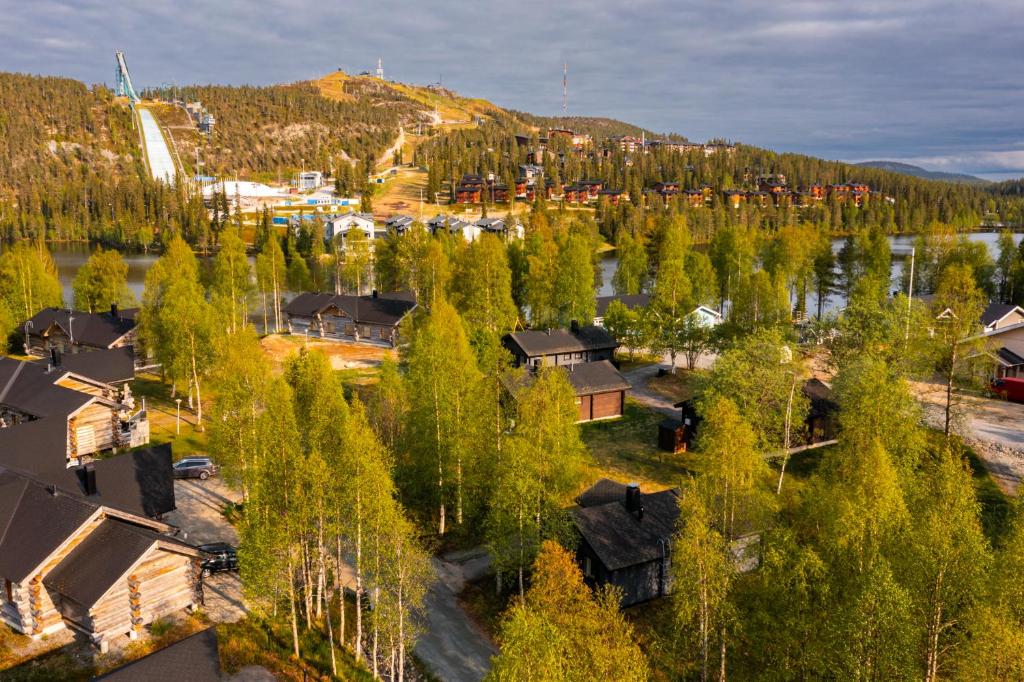 an aerial view of a village with houses and trees at Rukan Talvihovi in Ruka