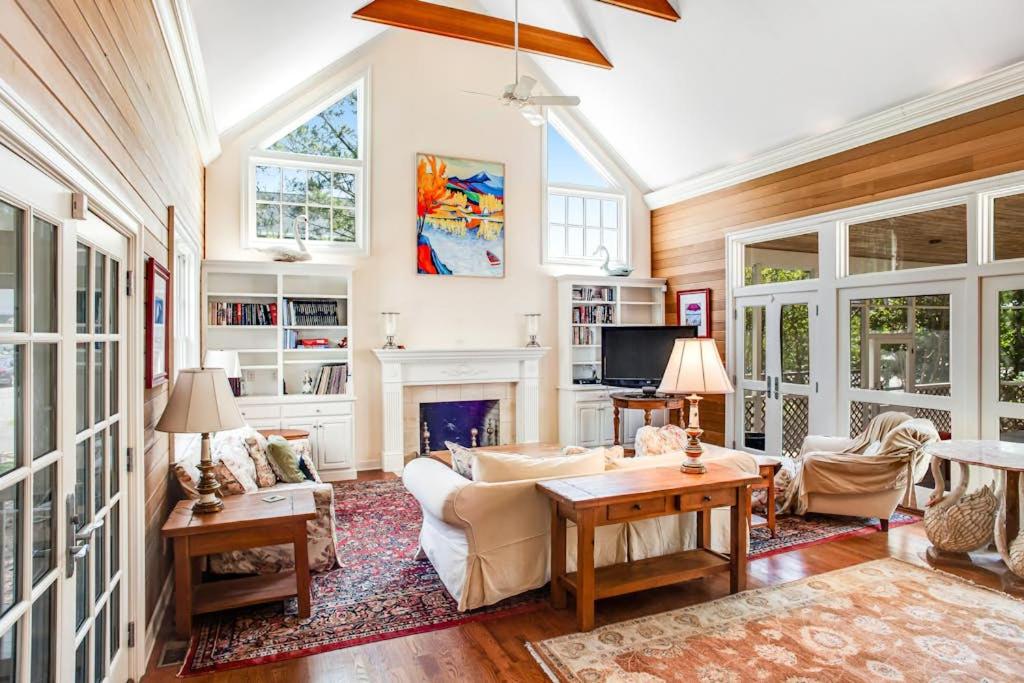 a living room with a couch and a fireplace at Rehoboth Beach --- 6 Holly Road in Rehoboth Beach