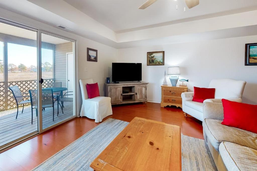 a living room with a couch and a table at Stewards Watch -- 539C Hudson in Bethany Beach