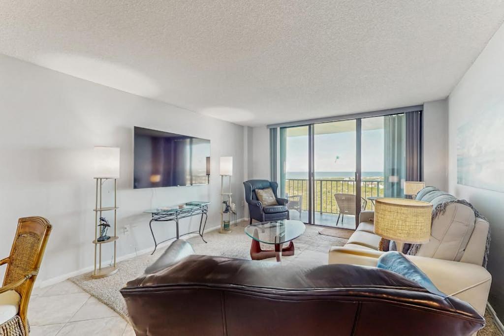 a living room with a couch and a table at Seaview Sunsets in Marco Island