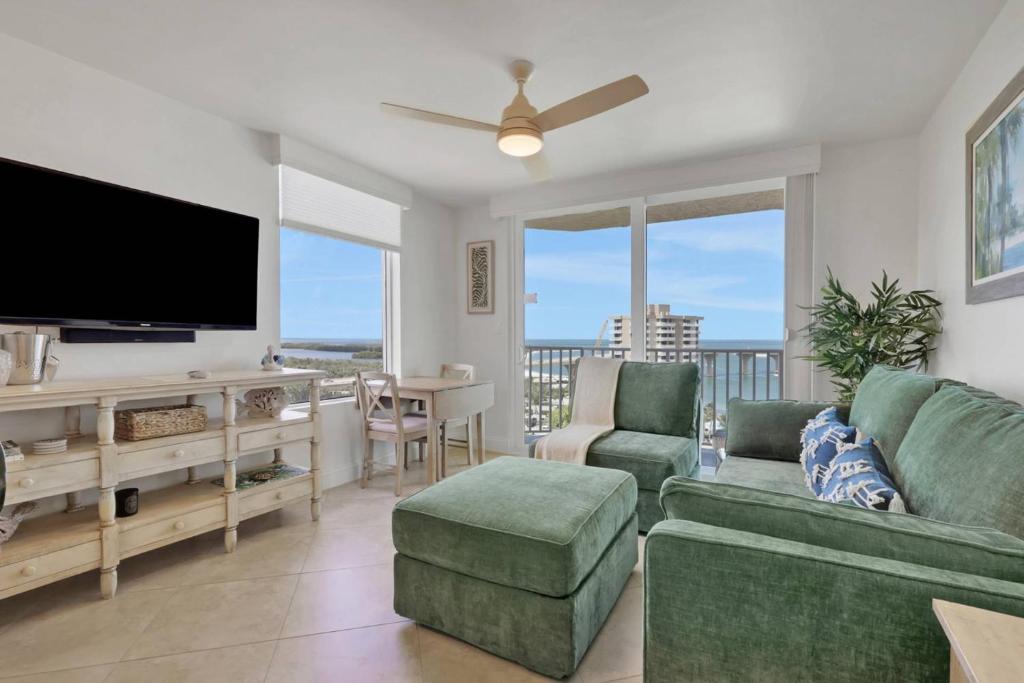 a living room with a flat screen tv and a couch at Lovers Key Resort 1107 in Fort Myers Beach