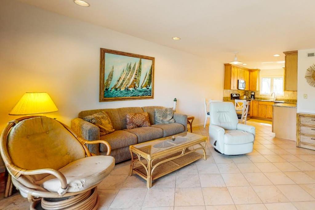 a living room with a couch and a table at Sea Colony - 1004D Brighton Vw in Bethany Beach