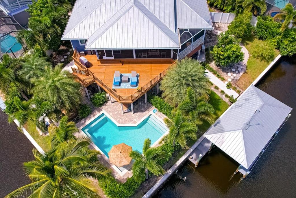 an aerial view of a house with a swimming pool at Coastal Escape in Saint James City