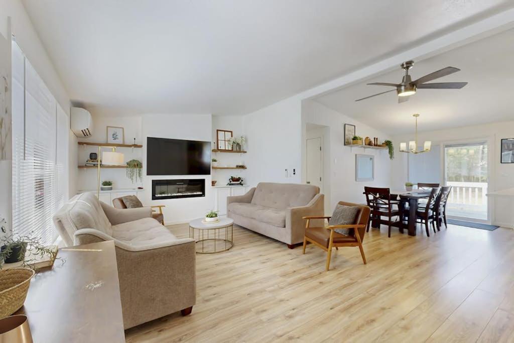 a living room with a couch and a table at Whispering Pines in Wisconsin Dells