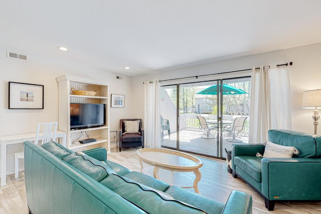 a living room with a couch and a table at Sea Colony --- 3404 Round Robin Way in Bethany Beach